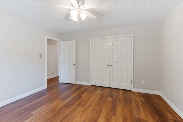 1504 Teal Wing Ln, Memphis, TN 38016 - unfurnished bedroom with wood finished floors, a closet, a textured ceiling, and ceiling fan