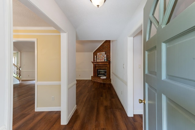 1504 Teal Wing Ln, Memphis, TN 38016 - hall with dark wood-style flooring, vaulted ceiling, and a textured ceiling
