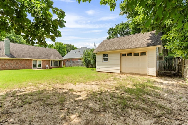 1504 Teal Wing Ln, Memphis, TN 38016 - view of yard with a garage and an outbuilding