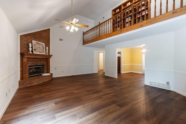 1504 Teal Wing Ln, Memphis, TN 38016 - unfurnished living room with ceiling fan, a brick fireplace, wood finished floors, and high vaulted ceiling