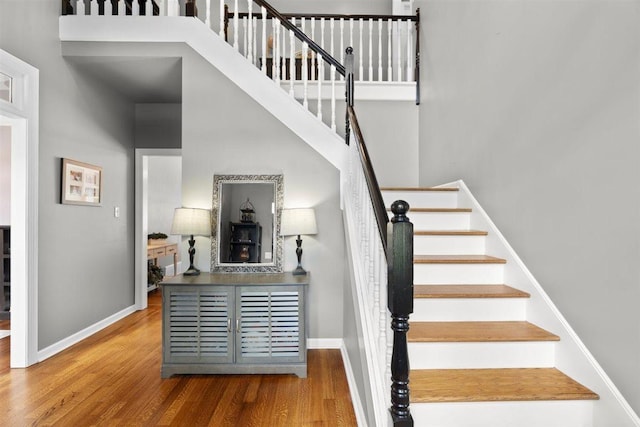 1775 Lisson Cv, Collierville, TN 38017 - stairway featuring wood finished floors and a towering ceiling