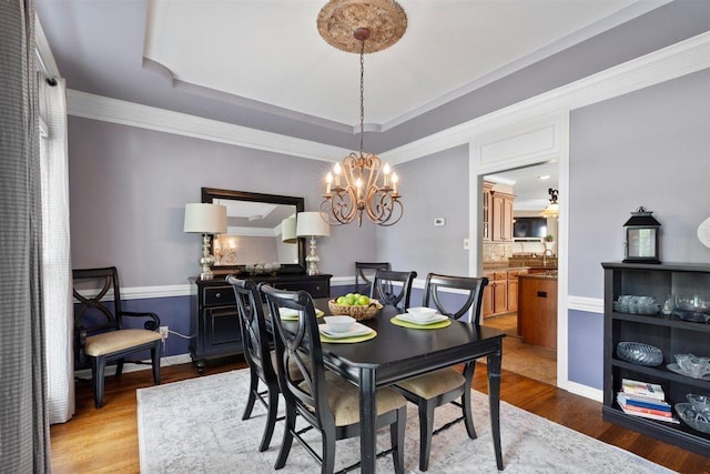 1775 Lisson Cv, Collierville, TN 38017 - dining area featuring wood finished floors, a chandelier, and a tray ceiling