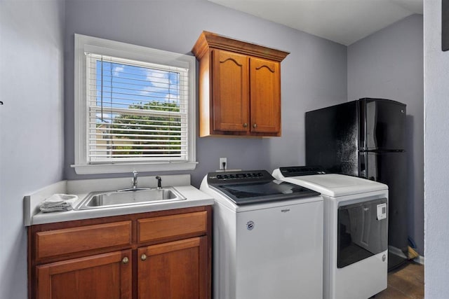 1775 Lisson Cv, Collierville, TN 38017 - laundry area featuring washing machine and dryer and cabinet space
