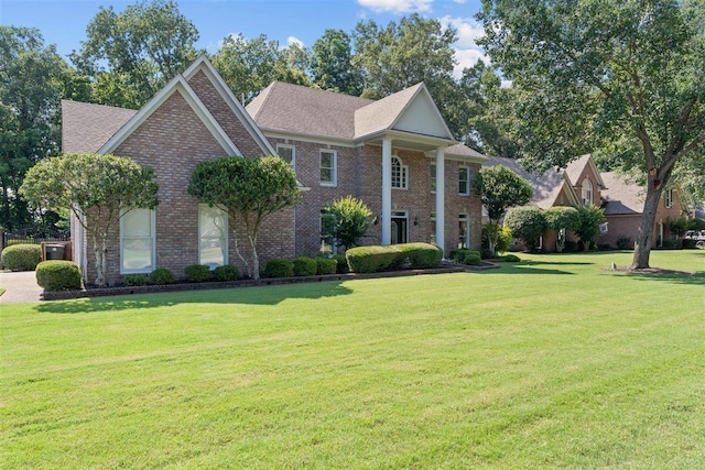 1775 Lisson Cv, Collierville, TN 38017 - neoclassical home with brick siding and a front lawn