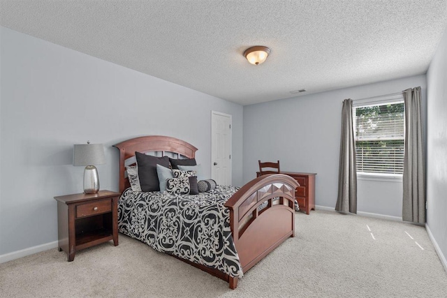 1775 Lisson Cv, Collierville, TN 38017 - carpeted bedroom featuring a textured ceiling and baseboards