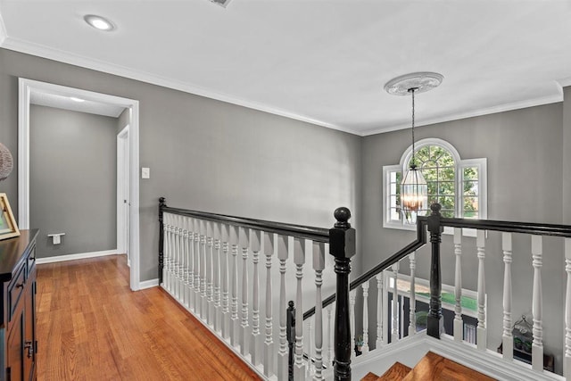 1775 Lisson Cv, Collierville, TN 38017 - corridor with an upstairs landing, wood finished floors, and ornamental molding