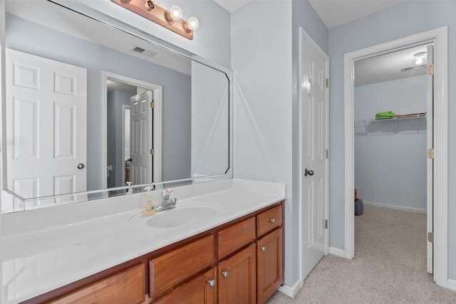1775 Lisson Cv, Collierville, TN 38017 - bathroom featuring vanity and a spacious closet