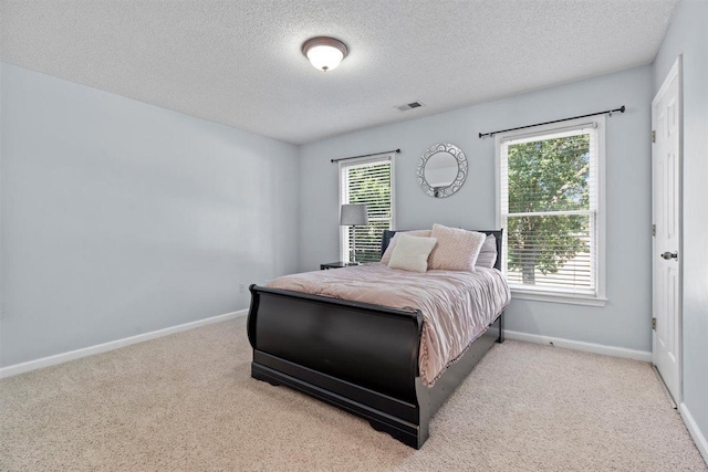 1775 Lisson Cv, Collierville, TN 38017 - bedroom with a textured ceiling and carpet