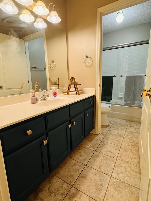 902 Wildbird Cv, Collierville, TN 38017 - full bath featuring double vanity, shower / bath combination with glass door, tile patterned flooring, and a textured ceiling