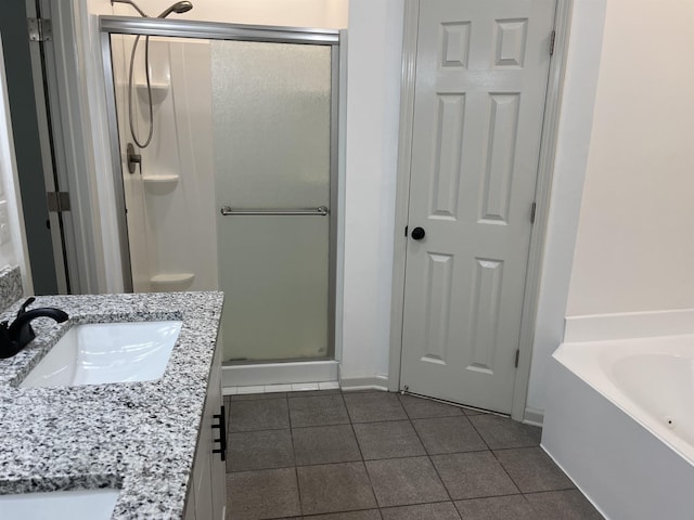 1319 E Island Pl E, Memphis, TN 38103 - full bath with a stall shower, tile patterned floors, vanity, and a bath