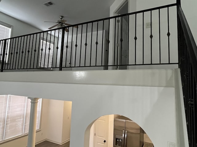 1319 E Island Pl E, Memphis, TN 38103 - staircase with a ceiling fan and arched walkways