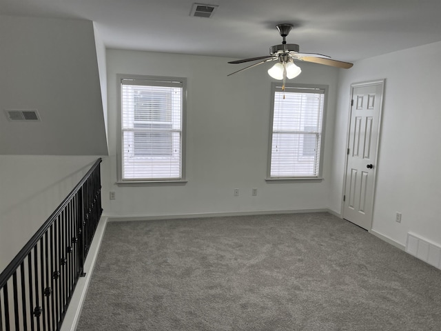1319 E Island Pl E, Memphis, TN 38103 - unfurnished room featuring carpet floors, a ceiling fan, and plenty of natural light