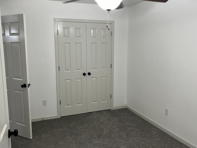 1319 E Island Pl E, Memphis, TN 38103 - unfurnished bedroom featuring dark carpet, a closet, and ceiling fan