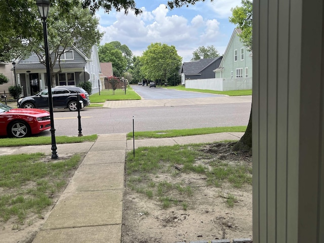 1319 E Island Pl E, Memphis, TN 38103 - view of asphalt street with sidewalks, street lighting, and a residential view