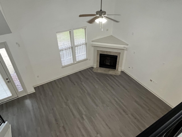 1319 E Island Pl E, Memphis, TN 38103 - unfurnished living room featuring dark wood-type flooring, a tiled fireplace, ceiling fan, and french doors