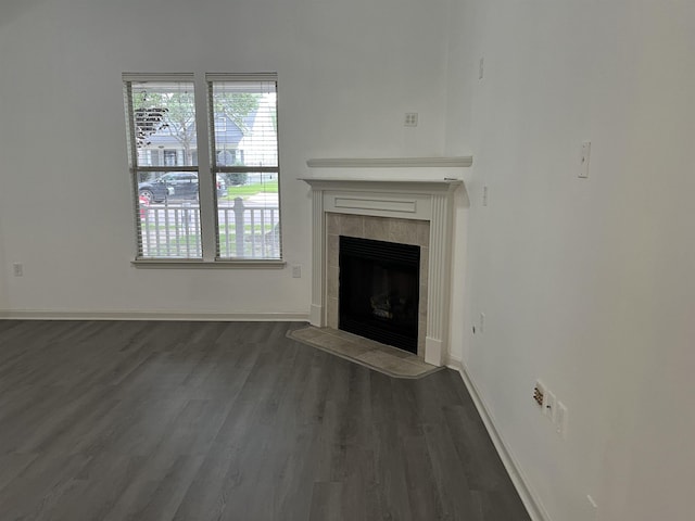 1319 E Island Pl E, Memphis, TN 38103 - unfurnished living room with dark wood finished floors and a tile fireplace