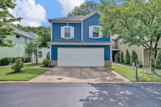 1160 Harbor River Cv, Memphis, TN 38103 - view of front of property featuring brick siding, driveway, a front lawn, and an attached garage