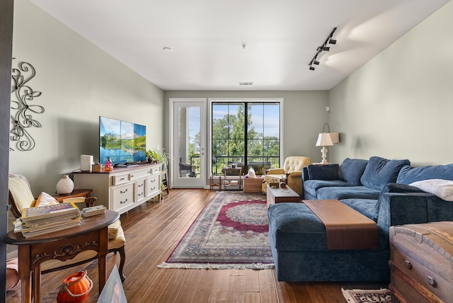380 N Island Dr Unit 302, Memphis, TN 38103 - living room featuring track lighting and dark wood-style floors