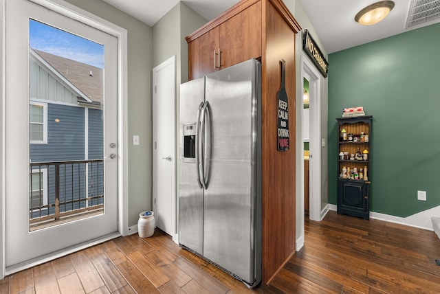380 N Island Dr Unit 302, Memphis, TN 38103 - kitchen with stainless steel fridge, hardwood / wood-style flooring, and brown cabinets