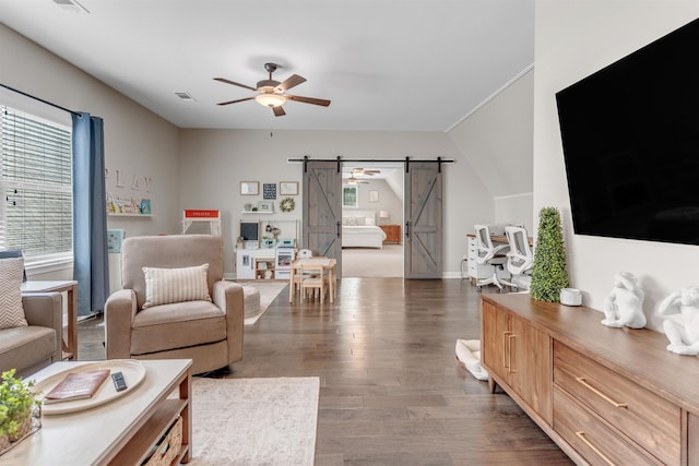 4712 Carousel Ln, Collierville, TN 38017 - living room featuring a barn door, healthy amount of natural light, wood finished floors, and ceiling fan
