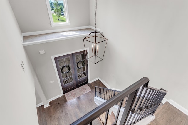 4712 Carousel Ln, Collierville, TN 38017 - foyer entrance featuring wood finished floors, a chandelier, and french doors