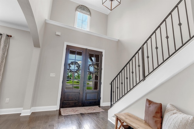 4712 Carousel Ln, Collierville, TN 38017 - entryway featuring wood finished floors, stairs, crown molding, a chandelier, and a high ceiling