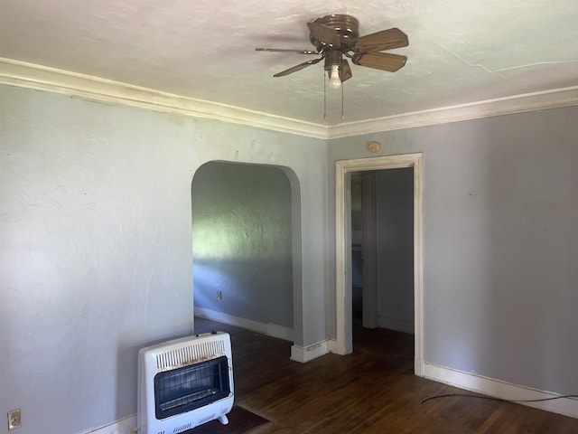 827 E Mallory Ave E, Memphis, TN 38106 - unfurnished living room with heating unit, ceiling fan, wood finished floors, arched walkways, and crown molding