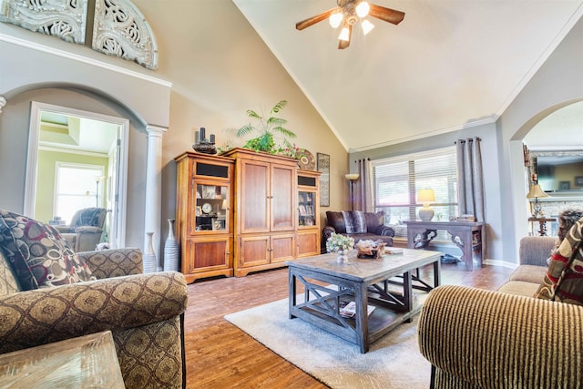 4362 Bridgestone Cir, Bartlett, TN 38135 - living area featuring arched walkways, ceiling fan, ornate columns, plenty of natural light, and high vaulted ceiling