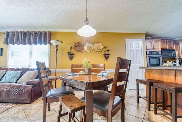 4362 Bridgestone Cir, Bartlett, TN 38135 - dining area featuring a textured ceiling, crown molding, wainscoting, and light tile patterned flooring