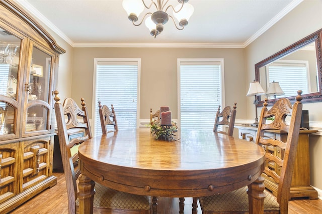4362 Bridgestone Cir, Bartlett, TN 38135 - dining space with a chandelier, light wood-style flooring, crown molding, and plenty of natural light