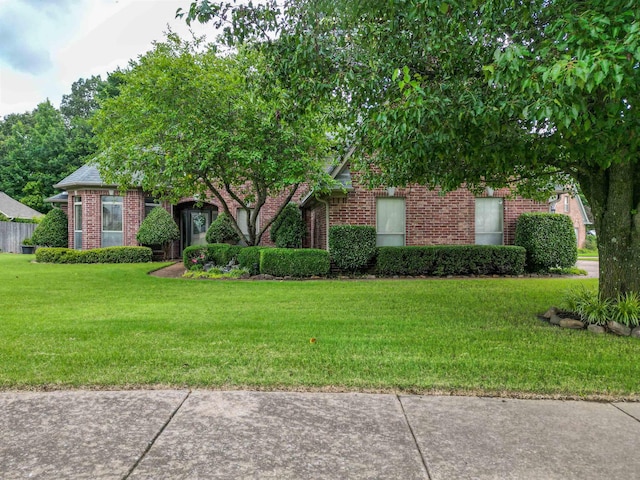 4362 Bridgestone Cir, Bartlett, TN 38135 - obstructed view of property with brick siding and a front yard