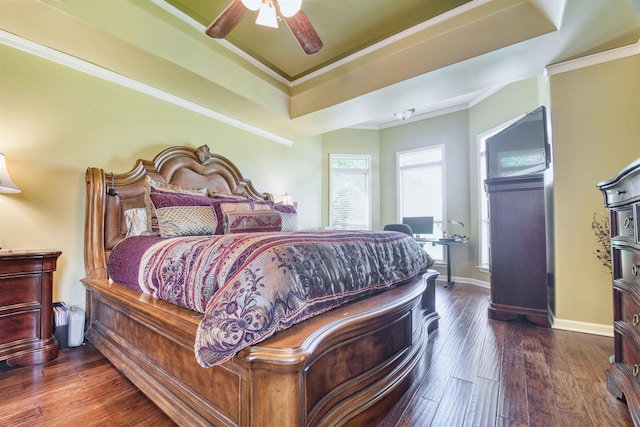 4362 Bridgestone Cir, Bartlett, TN 38135 - bedroom featuring dark wood-type flooring, crown molding, a tray ceiling, and ceiling fan