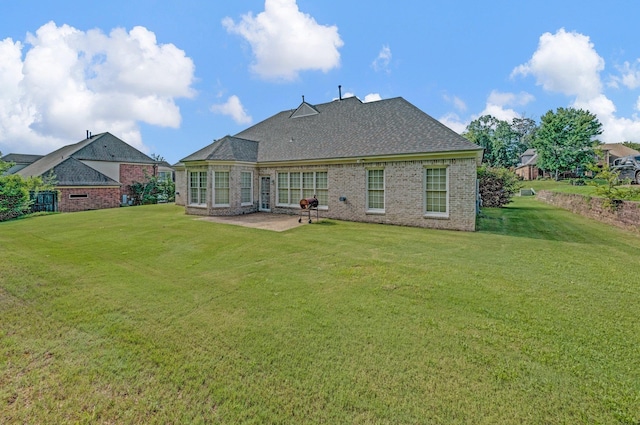 10505 Pisgah Forest Ln, Cordova, TN 38016 - rear view of house with a patio area, a lawn, brick siding, and a shingled roof