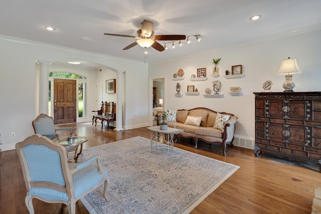 9824 Woodland Run Ln, Cordova, TN 38018 - living room with decorative columns, arched walkways, a ceiling fan, ornamental molding, and wood finished floors