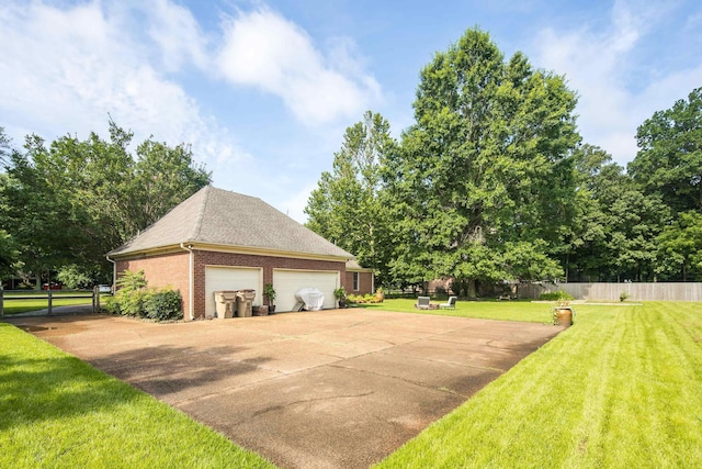 9824 Woodland Run Ln, Cordova, TN 38018 - view of home's exterior with brick siding, an outdoor structure, and a shingled roof