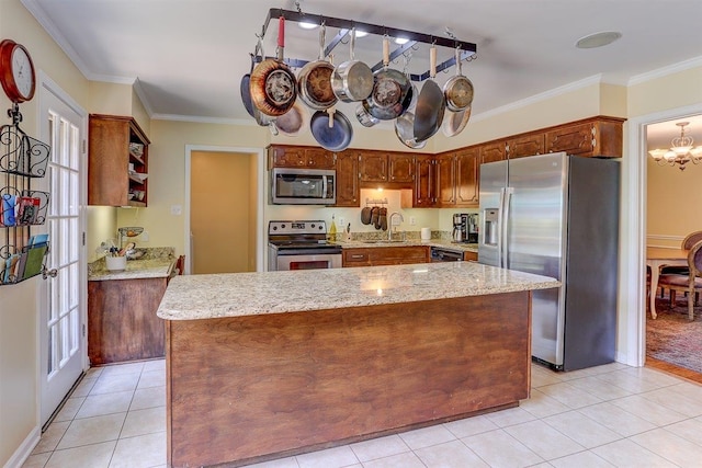1577 Bubbling Brook Dr, Germantown, TN 38138 - kitchen with stainless steel appliances, ornamental molding, a chandelier, light tile patterned floors, and a kitchen island