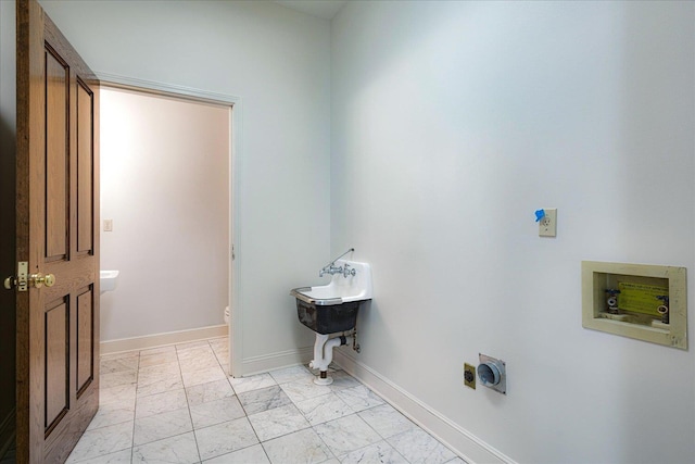 1035 Humphrey Oaks Cir, Memphis, TN 38120 - laundry area with electric dryer hookup, hookup for a washing machine, and light marble finish flooring