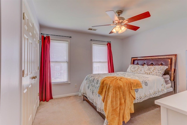 8973 E Carrollwood Ln, Memphis, TN 38016 - bedroom with light colored carpet and ceiling fan