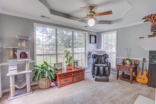8973 E Carrollwood Ln, Memphis, TN 38016 - living area with ceiling fan, a raised ceiling, carpet, and ornamental molding