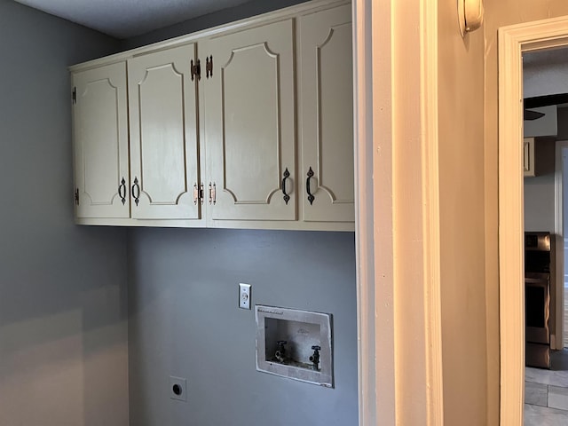 4282 Millbranch Rd, Memphis, TN 38116 - laundry room featuring cabinet space, electric dryer hookup, and washer hookup