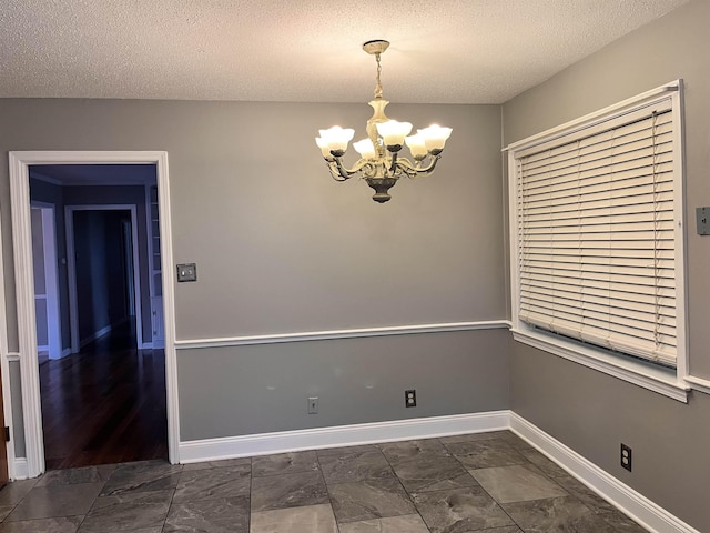 4282 Millbranch Rd, Memphis, TN 38116 - empty room featuring a chandelier and a textured ceiling