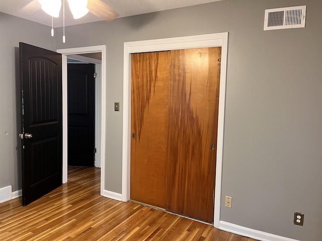 4282 Millbranch Rd, Memphis, TN 38116 - unfurnished bedroom featuring wood finished floors and a closet