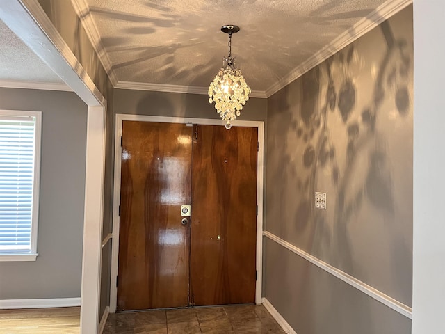 4282 Millbranch Rd, Memphis, TN 38116 - doorway featuring a chandelier, healthy amount of natural light, a textured ceiling, and crown molding