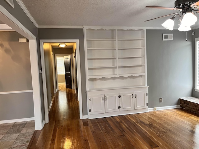 4282 Millbranch Rd, Memphis, TN 38116 - interior space with crown molding, dark wood-type flooring, and a textured ceiling