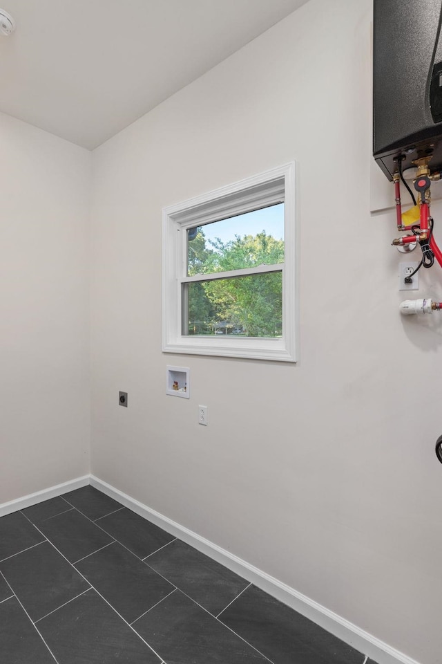 17 County Road 233rd Rd, Corinth, MS 38834 - laundry area with hookup for an electric dryer, dark tile patterned flooring, and washer hookup