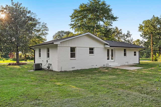 17 County Road 233rd Rd, Corinth, MS 38834 - back of property with french doors, crawl space, brick siding, and a lawn