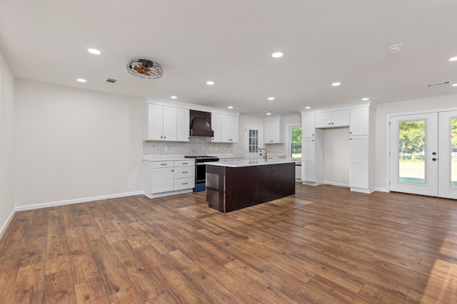 17 County Road 233rd Rd, Corinth, MS 38834 - kitchen featuring stove, custom range hood, dark wood finished floors, healthy amount of natural light, and recessed lighting