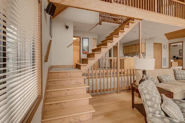 staircase featuring light hardwood / wood-style floors