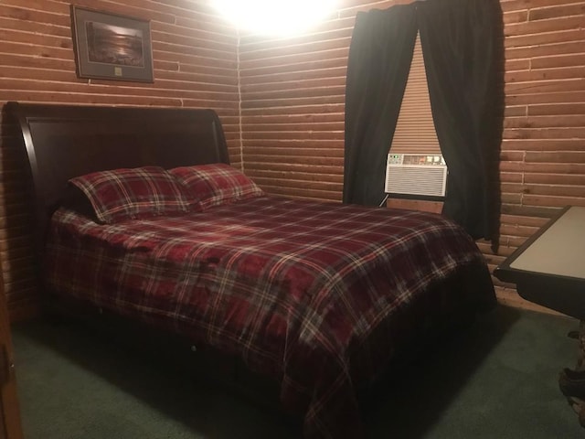 carpeted bedroom featuring brick wall