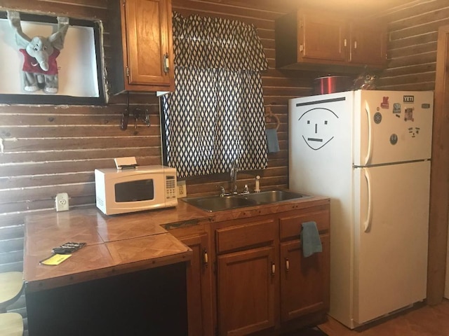 kitchen with white appliances and sink